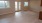 a room with a wood floor and windows at a new apartment in Dayton Ohio