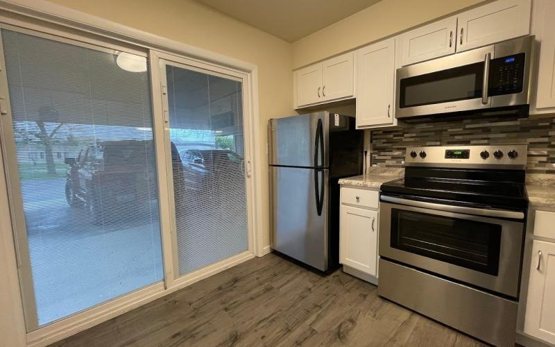 a kitchen with white cabinets at a pet friendly apartment in Dayton Ohio