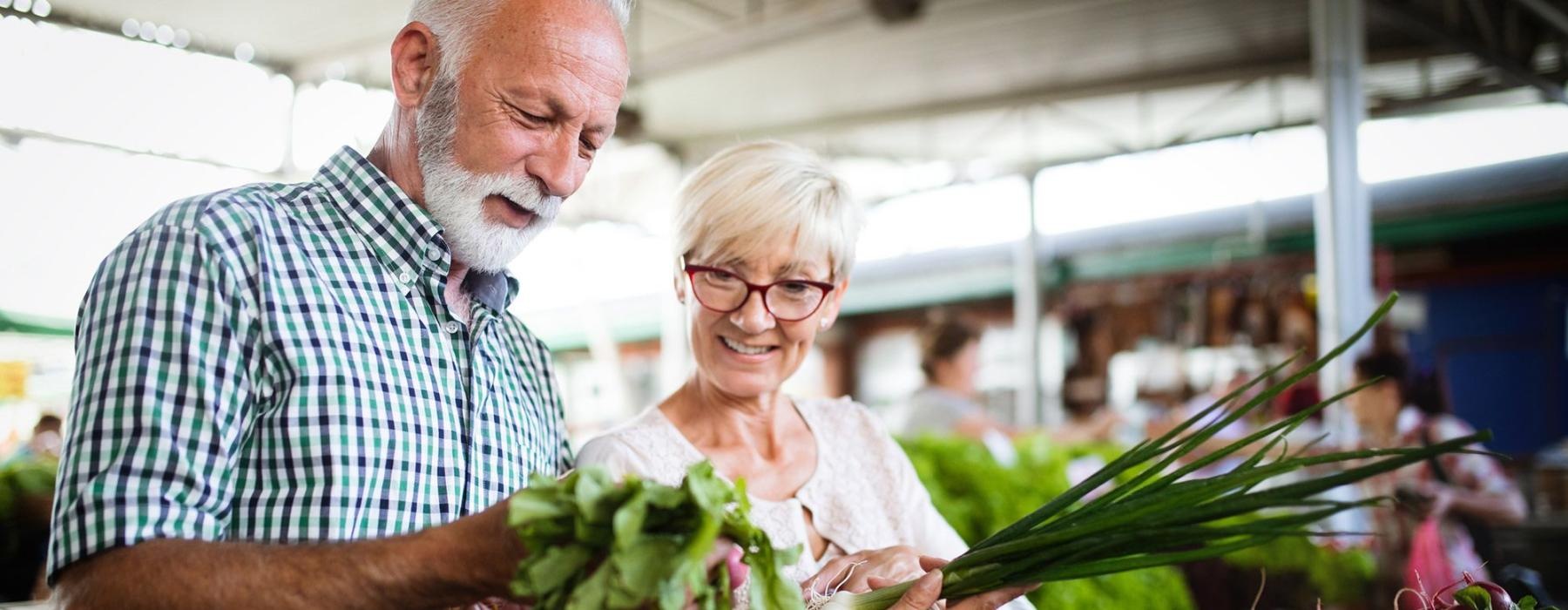 a man and a woman at a farmers market near a 55 and older apartment in Dayton Ohio